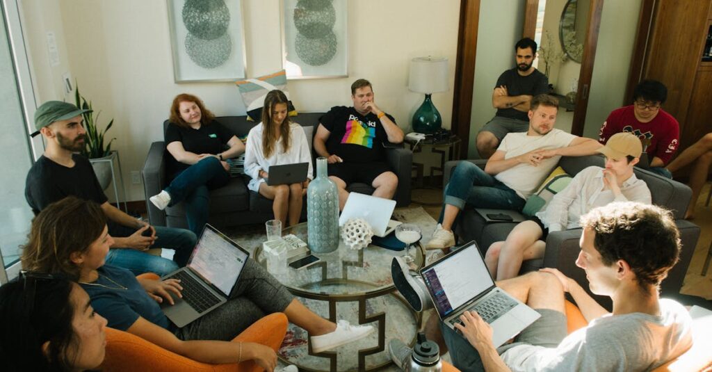 A diverse group of adults collaborating in a relaxed home office environment.
